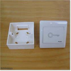 Plastic Push Button Switch With "DOOR EXIT" Printed On Top.